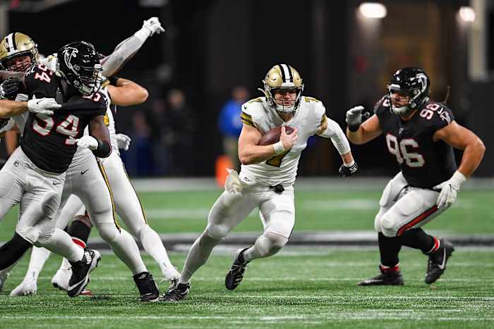 Nov 28, 2019; Atlanta, GA, USA; New Orleans Saints quarterback Taysom Hill (7) runs through the Atlanta Falcons defense for a touchdown during the first half at Mercedes-Benz Stadium. Mandatory Credit: D